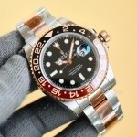 Rolex GMT-Master series, black dial, black and red bezel, 40mm, gold and silver Oyster bracelet.